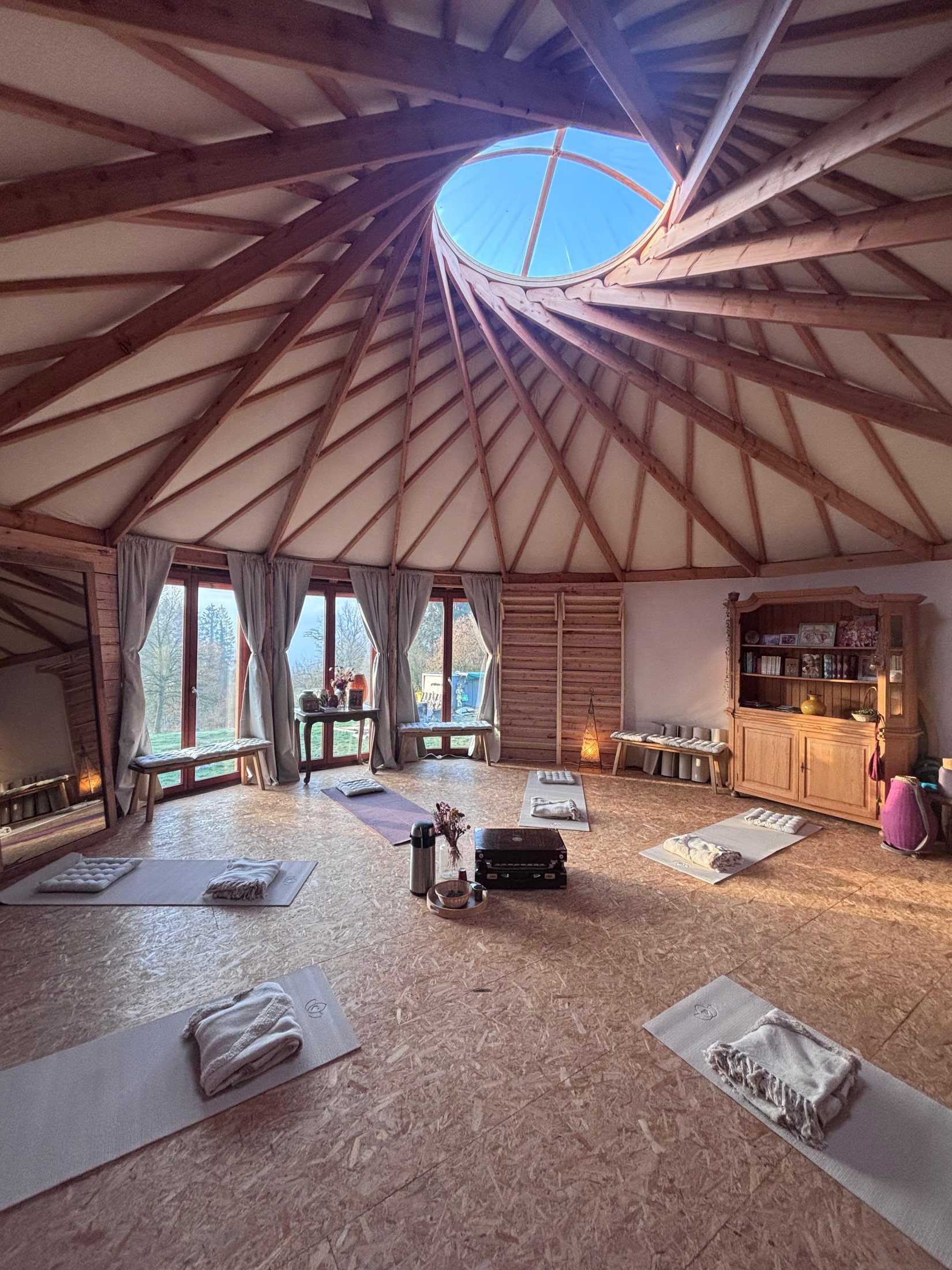 Premashala empty interior with roof and yoga mats